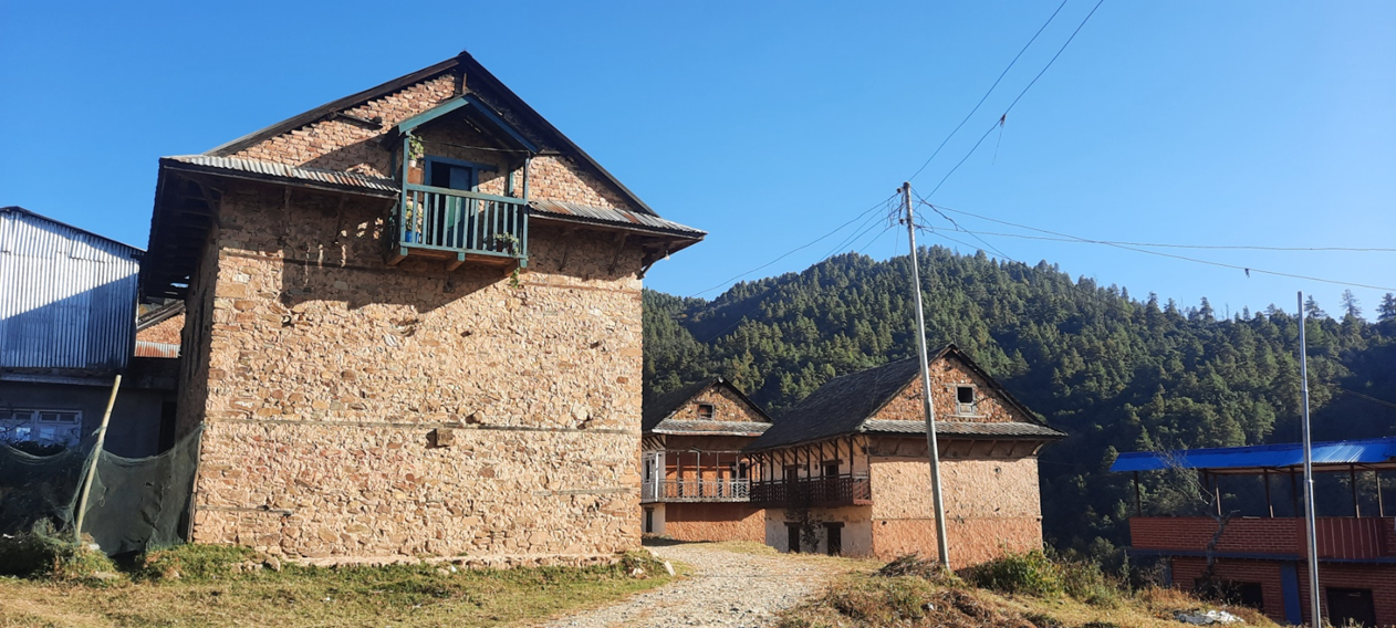 Traditional stone masonry buildings in a rural hill settlement